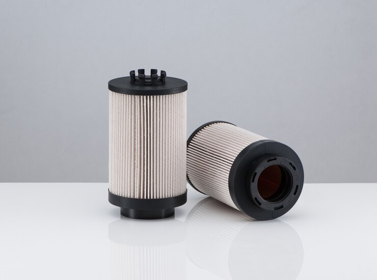 two-automotive-filter-cylindrical-shape-white-background-with-reflection_508835-5081