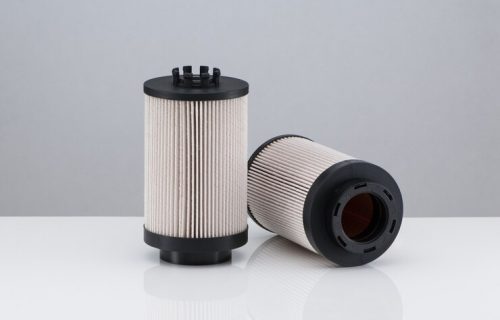 two-automotive-filter-cylindrical-shape-white-background-with-reflection_508835-5081